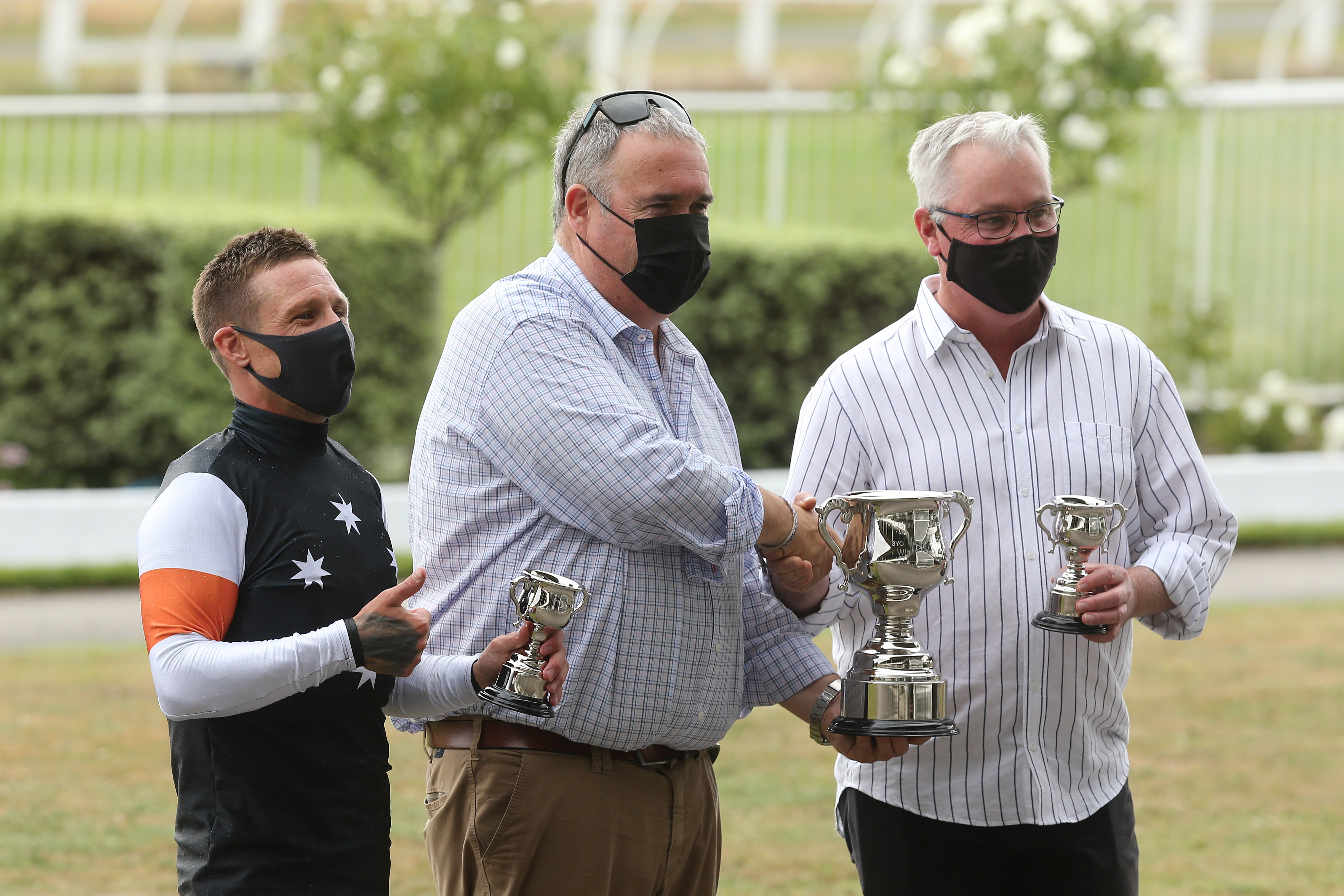 L-R: Michael McNab, Andrew ‘Butch’ Castles of Waikato Racing Club, and trainer Tony Pike.  Photo: Trish Dunell
